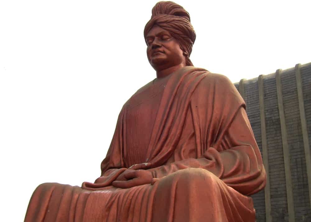 Big red color statue of Swami Vivekananda yoga
