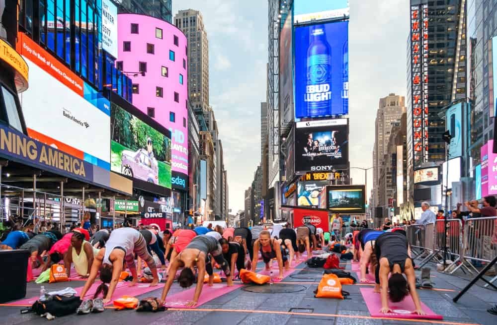 People stretching in the yoga annual concentration Times Square