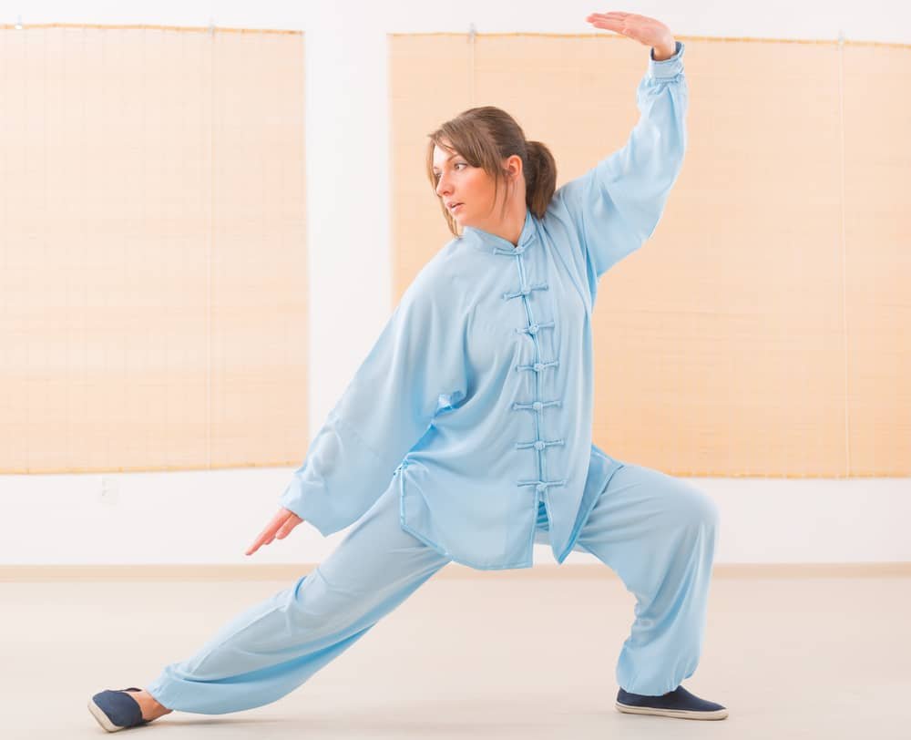 woman  doing qi  gong tai chi exercise